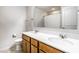 Bathroom features double sinks, wood cabinets, a large mirror and tiled floors at 1065 Park Ct, Avon, IN 46123