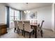 Bright dining room featuring a chandelier, a large window, and seating for six at 1065 Park Ct, Avon, IN 46123