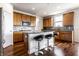 Modern kitchen featuring a center island with bar seating and wood cabinets at 1065 Park Ct, Avon, IN 46123