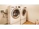 Modern laundry room with front load washer and dryer; offers functionality and convenience at 1065 Park Ct, Avon, IN 46123