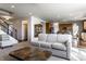 Open-concept living room with a staircase, and seamless transition to the kitchen, ideal for modern living and entertaining at 1065 Park Ct, Avon, IN 46123