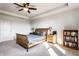 Comfortable main bedroom featuring a ceiling fan, tray ceiling, and plenty of natural light at 1065 Park Ct, Avon, IN 46123