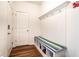 Organized mudroom with a built-in bench, coat hooks, and storage, perfect for entryway convenience at 1065 Park Ct, Avon, IN 46123