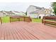 Expansive back deck with built-in seating offers an inviting outdoor space at 10722 Mistflower Way, Indianapolis, IN 46235