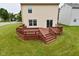 Spacious stained wood back deck with stairs to the yard, ideal for outdoor entertaining at 10722 Mistflower Way, Indianapolis, IN 46235