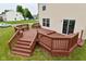 Multi-level wooden back deck offers an expansive outdoor living area at 10722 Mistflower Way, Indianapolis, IN 46235