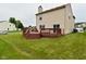 Grassy backyard features a spacious back deck, ideal for outdoor enjoyment at 10722 Mistflower Way, Indianapolis, IN 46235