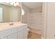 Well-lit bathroom features a vanity, shower, and tub combination, perfect for relaxation at 10722 Mistflower Way, Indianapolis, IN 46235