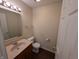 Cozy bathroom with wood cabinets and modern fixtures at 10722 Mistflower Way, Indianapolis, IN 46235