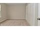Bedroom with neutral walls, plush carpeting, and a double-door closet at 10722 Mistflower Way, Indianapolis, IN 46235