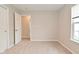 Bright bedroom with neutral walls, plush carpet, and window with natural light at 10722 Mistflower Way, Indianapolis, IN 46235