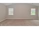 Spacious bedroom with vaulted ceiling and two windows, offering ample natural light at 10722 Mistflower Way, Indianapolis, IN 46235