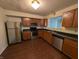 Modern kitchen featuring stainless steel appliances and wood cabinets at 10722 Mistflower Way, Indianapolis, IN 46235