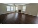 Spacious living room boasts hardwood floors, a cozy fireplace, and ample natural light at 10722 Mistflower Way, Indianapolis, IN 46235
