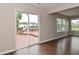 Sliding glass door providing access to the wooden patio in the backyard at 10722 Mistflower Way, Indianapolis, IN 46235