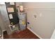 Utility room featuring a water heater, HVAC, and some wire shelving at 10722 Mistflower Way, Indianapolis, IN 46235