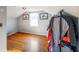 Attic space with hardwood floors, natural light, and space for storage at 10758 W State Road 142, Quincy, IN 47456
