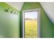 Cozy attic space with a window looking out to a green landscape at 10758 W State Road 142, Quincy, IN 47456