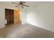 Cozy bedroom with neutral carpeting and closet space for organized storage at 108 N A St, Elwood, IN 46036