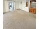Inviting living room with neutral carpeting, ready for your personal touch at 108 N A St, Elwood, IN 46036