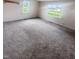 Spacious living room featuring neutral carpeting and ample natural light at 108 N A St, Elwood, IN 46036