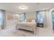 Inviting bedroom featuring neutral decor, a decorative rug, and bright windows at 1085 Bevy Blvd, Danville, IN 46122