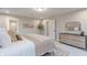 Bright bedroom featuring neutral decor, a decorative rug, and a stylish dresser at 1085 Bevy Blvd, Danville, IN 46122