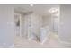 Hallway with white carpet, and white railing and trim at 1085 Bevy Blvd, Danville, IN 46122