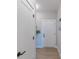 Bright hallway with a white front door, light wood floors, and modern fixtures at 1085 Bevy Blvd, Danville, IN 46122