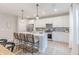 Well-lit kitchen with white cabinetry, stainless steel appliances, and a spacious island with bar seating at 1085 Bevy Blvd, Danville, IN 46122