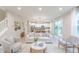Bright, open-concept living room featuring modern decor and lots of natural light from the large sliding glass door at 1085 Bevy Blvd, Danville, IN 46122
