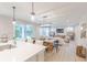 Spacious living space with an open layout, connecting the kitchen, dining area, and living room with outdoor access at 1085 Bevy Blvd, Danville, IN 46122