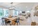 Open-concept living space showcasing a dining table, living room, and seamless transition to the outdoor patio at 1085 Bevy Blvd, Danville, IN 46122