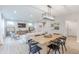 Open-concept living space featuring a dining table, kitchen, and living room with modern furnishings and decor at 1085 Bevy Blvd, Danville, IN 46122