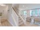 Elegant staircase leading to the second floor, with an open view to the living space at 1085 Bevy Blvd, Danville, IN 46122