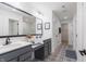 Stylish bathroom featuring a dual vanity, patterned tile, and a walk-in shower at 1088 Bevy Blvd, Danville, IN 46122