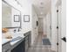 Modern bathroom with patterned tile floors, dual vanity, and a glass-enclosed shower at 1088 Bevy Blvd, Danville, IN 46122