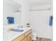 Well-lit bathroom with double sinks, a shower, and colorful decor at 1088 Bevy Blvd, Danville, IN 46122