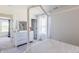 Bright bedroom with white walls, decor, and a large window showcasing natural light at 1088 Bevy Blvd, Danville, IN 46122