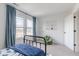 Bedroom with blue accents, natural light from a window, and decorative touches throughout the space at 1088 Bevy Blvd, Danville, IN 46122