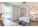 Bright bedroom with a house frame bed, decorative wall decals, and a view of the outdoors at 1088 Bevy Blvd, Danville, IN 46122