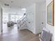 Bright foyer with natural light, wood floors, staircase and furniture at 1088 Bevy Blvd, Danville, IN 46122