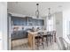 Modern kitchen with an island, stainless steel appliances, and contemporary light fixtures at 1088 Bevy Blvd, Danville, IN 46122
