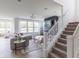 Open-concept living area with large windows, fireplace and neutral decor at 1088 Bevy Blvd, Danville, IN 46122