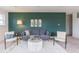 The cozy living room features modern decor, a comfortable gray sofa, accent chairs, and a unique coffee table at 1088 Bevy Blvd, Danville, IN 46122