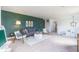Open living room with stylish seating, decor, an adjacent play area with kitchen, and plenty of natural light at 1088 Bevy Blvd, Danville, IN 46122