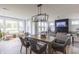 Spacious living room with a fireplace, large windows, and open to the dining and kitchen areas at 1088 Bevy Blvd, Danville, IN 46122
