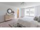 Serene main bedroom featuring a dresser, natural light, and stylish decor at 1088 Bevy Blvd, Danville, IN 46122