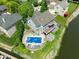 Aerial view of the home featuring the pool, deck, and waterfront access at 11061 Mast Ct, Fishers, IN 46040