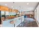 Basement bar area featuring granite counters, stainless appliances, and a nearby billiards table at 11061 Mast Ct, Fishers, IN 46040